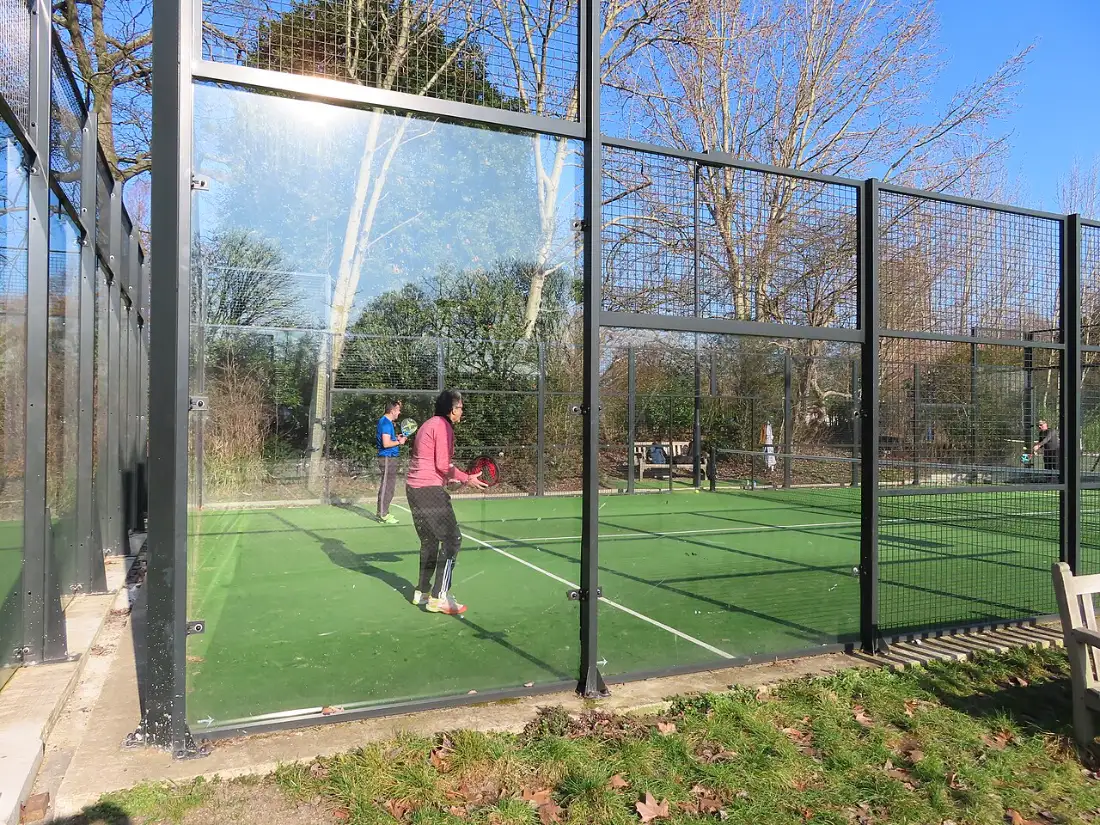 A padel court with glass and mesh walls