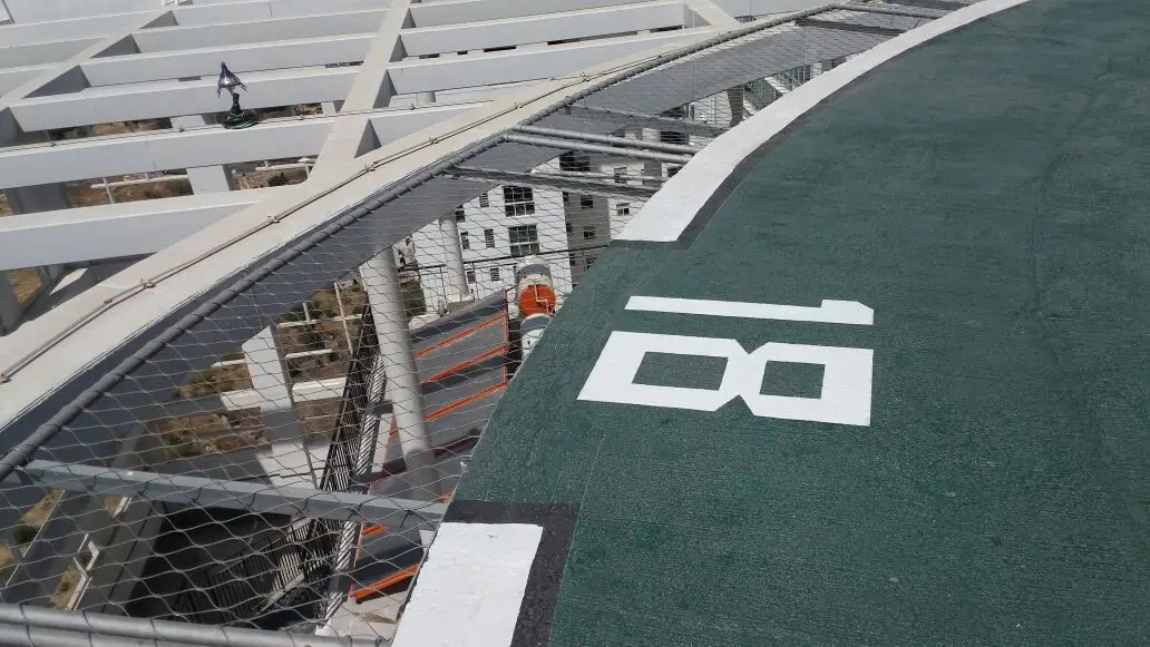 A helipad edge net on a steel frame